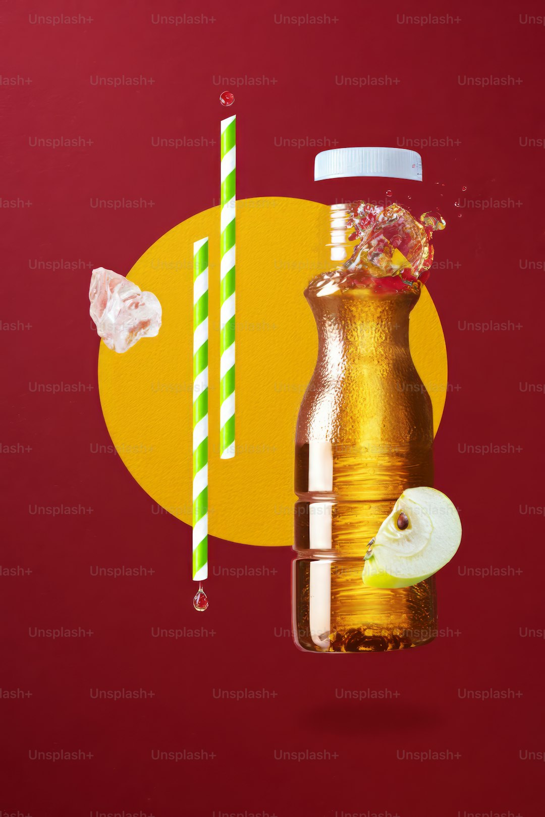 A bottle of liquid with a straw and apple slices