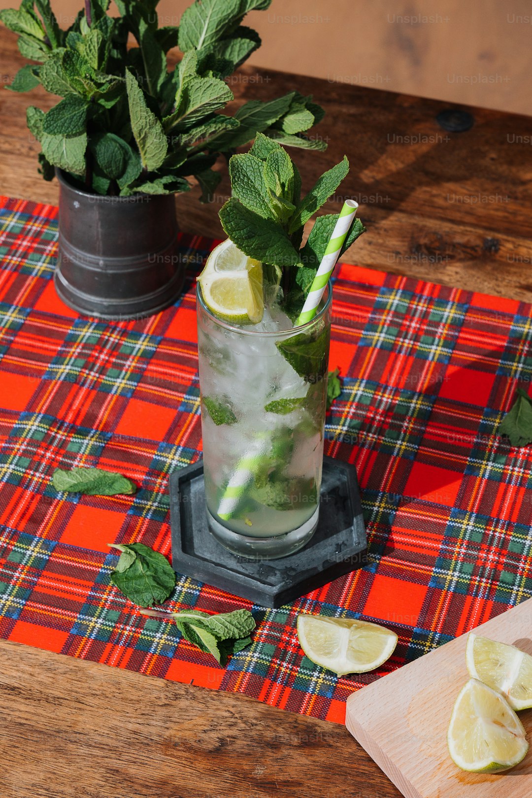 a glass of lemonade and mint on a table