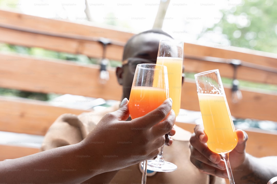 a couple of people that are holding some drinks