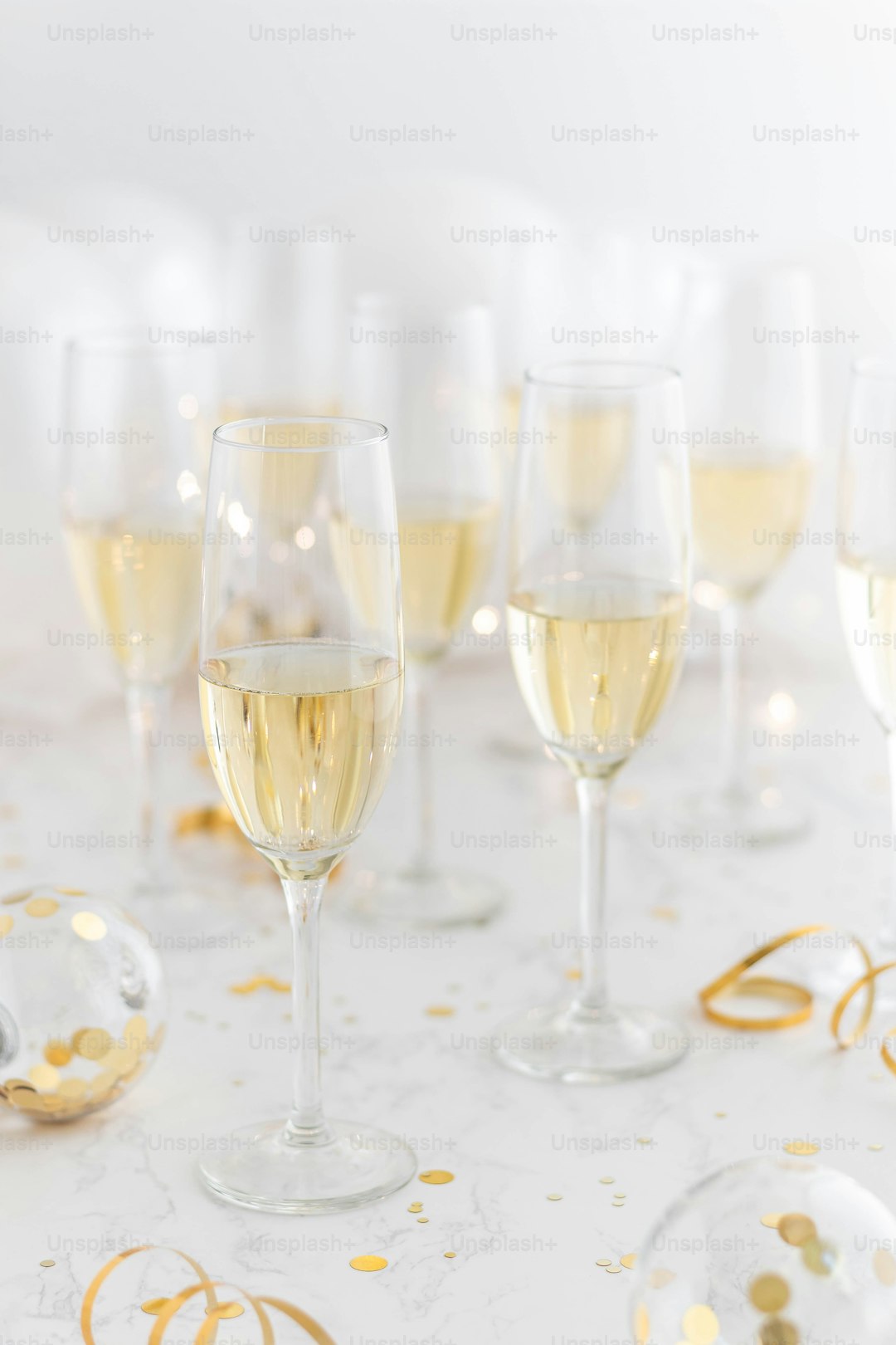 a group of wine glasses sitting on top of a table