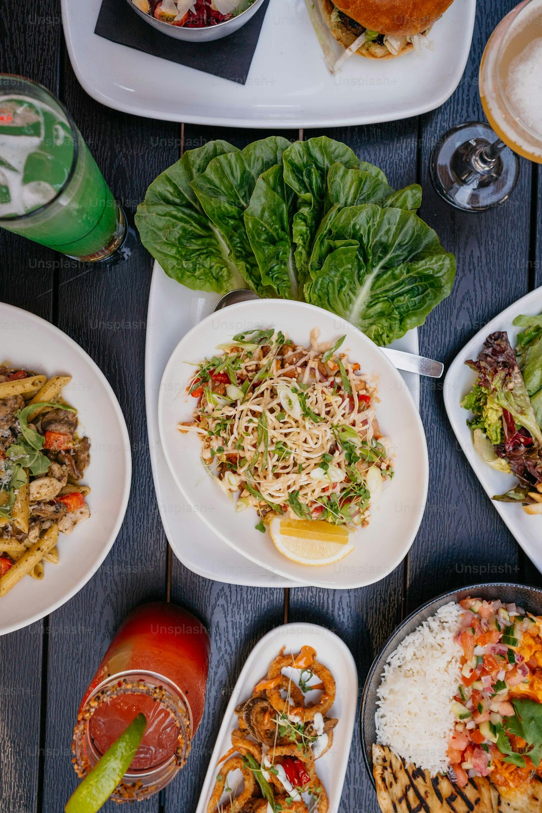a table topped with plates of food and drinks