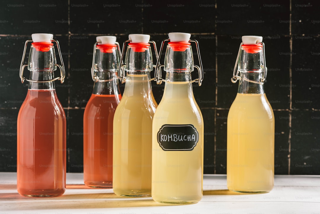 a group of bottles of liquid sitting next to each other