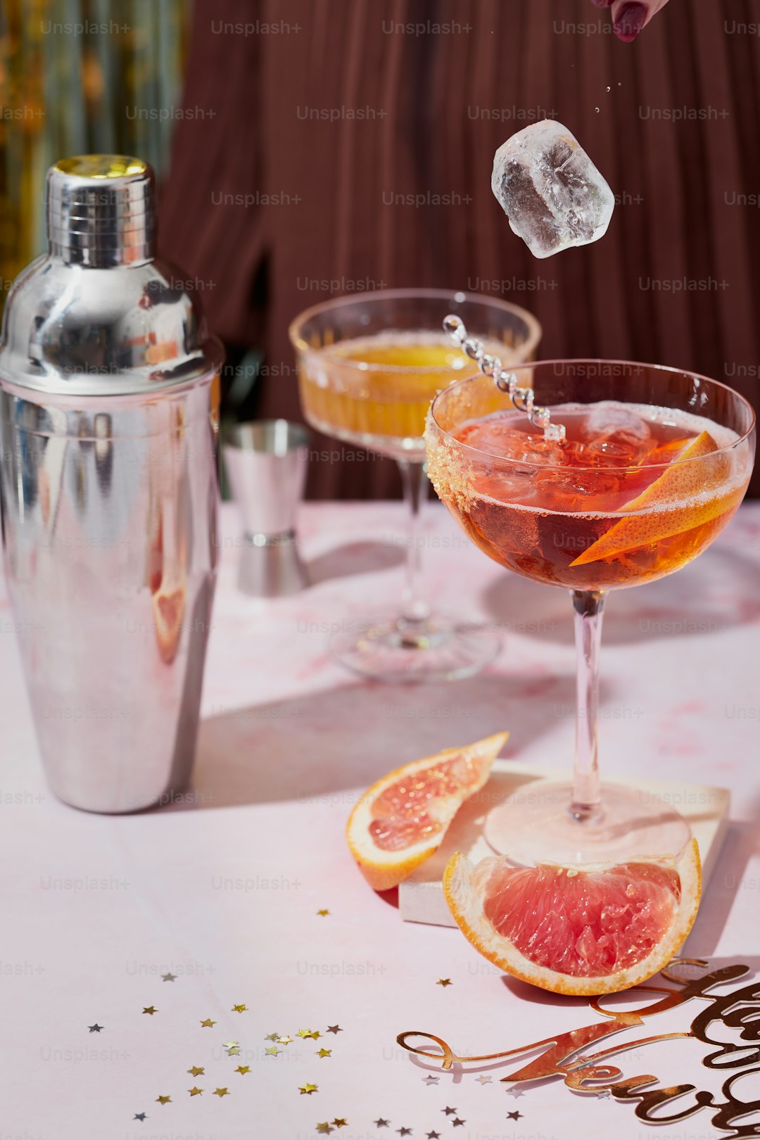 a table topped with glasses filled with drinks