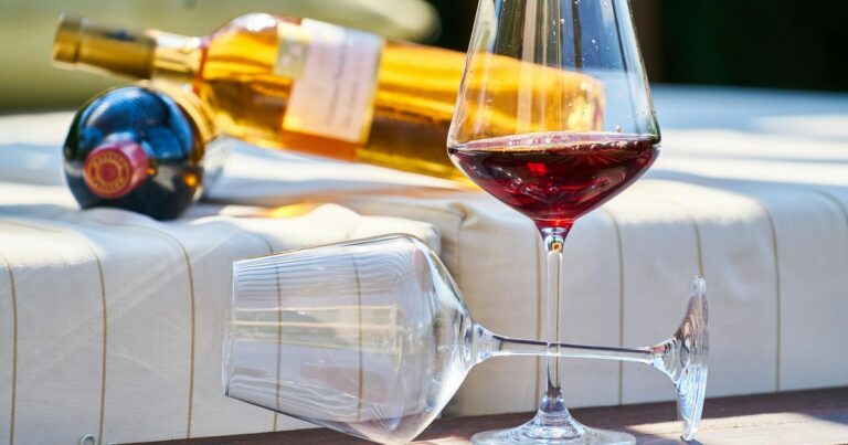 Wine glasses and bottles on outdoor lounge